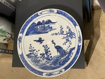 A Chinese famille verte 'yenyen' 'rice production' vase and a large blue and white 'peacock' dish, 19th C.