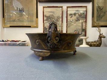 A large Chinese bronze tripod censer with chilong handles, Xuande mark, 18/19th C.