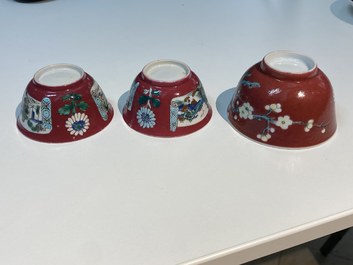 Three Chinese famille rose ruby-ground cups and saucers, Yongzheng