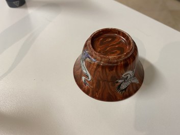 A pair of Chinese famille rose 'faux-bois' cups and saucers, Yongzheng/Qianlong