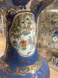 A Chinese famille verte powder blue-ground vase and a famille rose vase, 19th C.