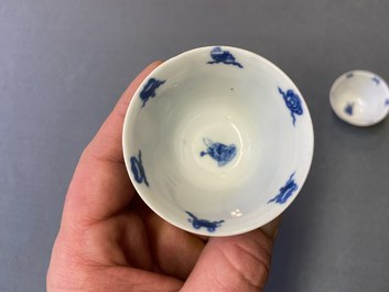 Three Chinese blue and white cups and two saucers, Kangxi