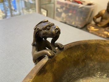 A large Chinese bronze tripod censer with chilong handles, Xuande mark, 18/19th C.