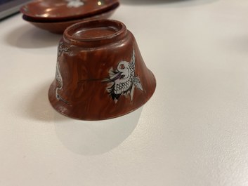 A pair of Chinese famille rose 'faux-bois' cups and saucers, Yongzheng/Qianlong