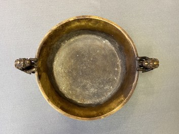 A large Chinese bronze tripod censer with chilong handles, Xuande mark, 18/19th C.
