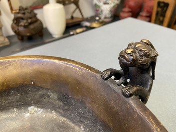 A large Chinese bronze tripod censer with chilong handles, Xuande mark, 18/19th C.