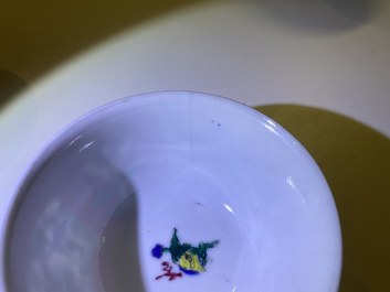 Three Chinese famille rose ruby-ground cups and saucers, Yongzheng
