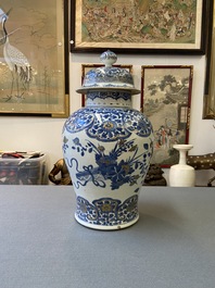 A Chinese gilt-heightened blue and white vase and cover, Kangxi/Yongzheng