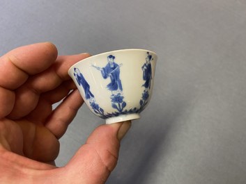 Three Chinese blue and white cups and two saucers, Kangxi