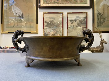 A large Chinese bronze tripod censer with chilong handles, Xuande mark, 18/19th C.