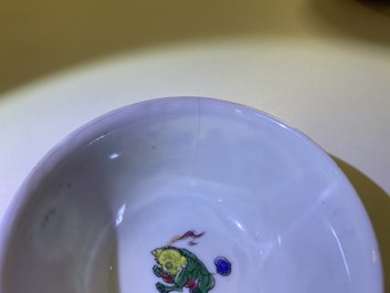 Three Chinese famille rose ruby-ground cups and saucers, Yongzheng