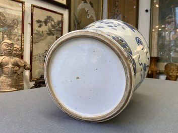 A Chinese gilt-heightened blue and white vase and cover, Kangxi/Yongzheng
