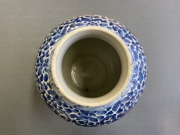 A Chinese gilt-heightened blue and white vase and cover, Kangxi/Yongzheng