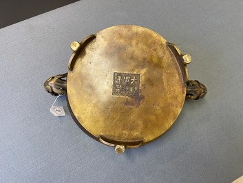 A large Chinese bronze tripod censer with chilong handles, Xuande mark, 18/19th C.