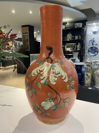 A Chinese famille rose 'sanduo' vase with applied design on a coral red ground, 19th C.