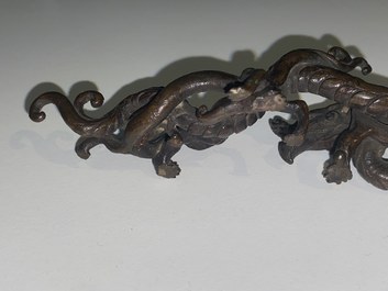 A rare Chinese bronze 'dragon' brush rest, Yuan/Ming