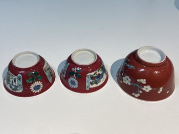 Three Chinese famille rose ruby-ground cups and saucers, Yongzheng