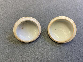 A pair of Chinese famille rose teapots and covers with applied design, Yongzheng