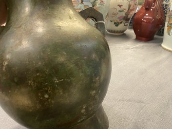 A Chinese archaistic bronze 'hu' vase with inscription, Ming