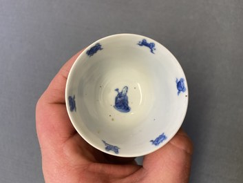 Three Chinese blue and white cups and two saucers, Kangxi