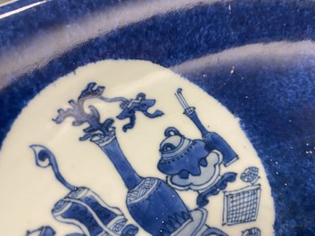 A Chinese blue, white and copper-red powder-blue-ground dish, Kangxi