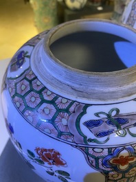 A pair of Chinese famille verte jars and covers, Kangxi