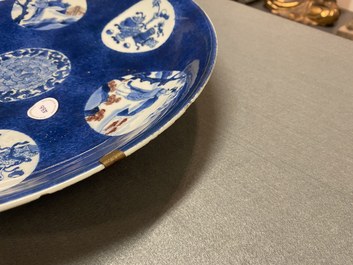 A Chinese blue, white and copper-red powder-blue-ground dish, Kangxi