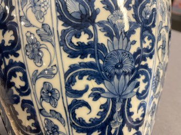 A Chinese blue and white vase and cover with floral design, Kangxi