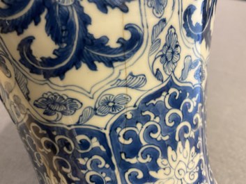 A Chinese blue and white vase and cover with floral design, Kangxi