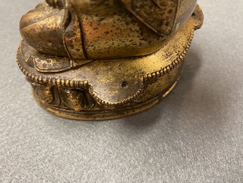 A Chinese gilt bronze 'Medicine Buddha' figure, 17/18th C.