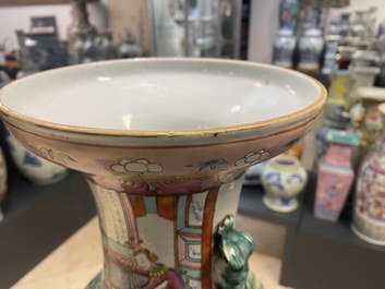 A pair of Chinese famille rose vases with temple scenes, 19th C.