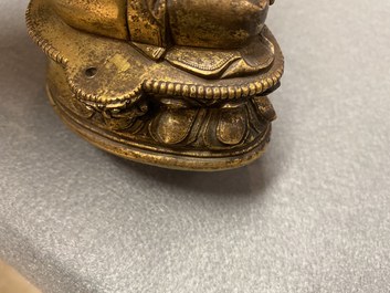 A Chinese gilt bronze 'Medicine Buddha' figure, 17/18th C.