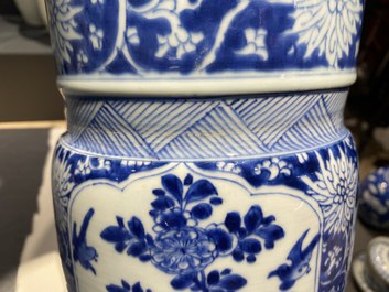 A Chinese blue and white 'gu' vase with floral and lanscape panels, Kangxi