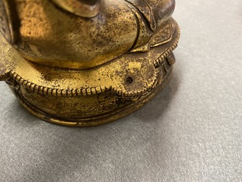 A Chinese gilt bronze 'Medicine Buddha' figure, 17/18th C.