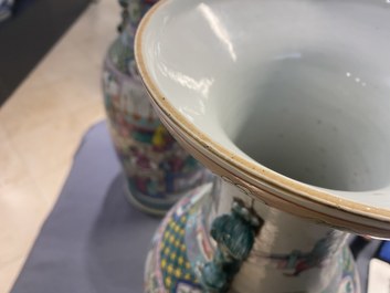 A pair of Chinese famille rose vases with temple scenes, 19th C.
