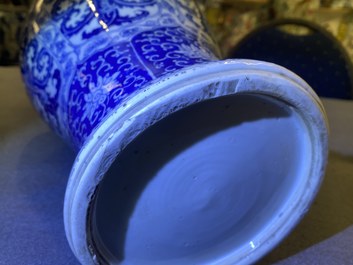 A Chinese blue and white vase and cover with floral design, Kangxi