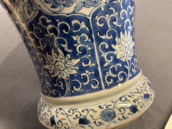A Chinese blue and white vase and cover with floral design, Kangxi