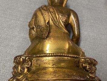 A Chinese gilt bronze 'Medicine Buddha' figure, 17/18th C.