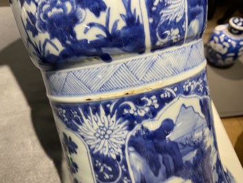 A Chinese blue and white 'gu' vase with floral and lanscape panels, Kangxi
