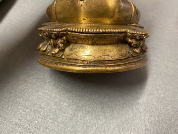 A Chinese gilt bronze 'Medicine Buddha' figure, 17/18th C.