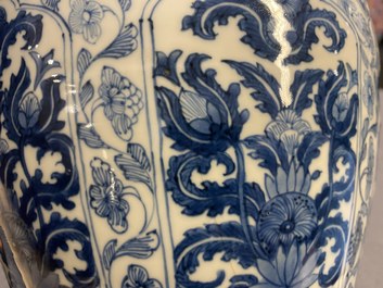 A Chinese blue and white vase and cover with floral design, Kangxi