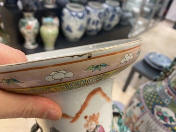 A pair of Chinese famille rose vases with temple scenes, 19th C.