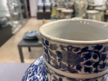 A Chinese blue and white vase and cover with floral design, Kangxi