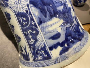 A Chinese blue and white 'gu' vase with floral and lanscape panels, Kangxi
