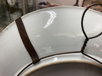 A Chinese blue, white and copper-red powder-blue-ground dish, Kangxi