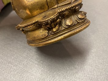 A Chinese gilt bronze 'Medicine Buddha' figure, 17/18th C.