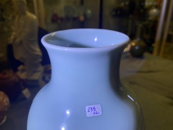 A Chinese monochrome blue censer and a white slip-decorated celadon vase, 18/19th C.