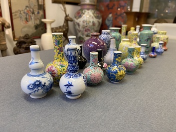Twenty-eight Chinese blue and white and famille rose minature vases, Kangxi and later