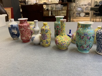Twenty-eight Chinese blue and white and famille rose minature vases, Kangxi and later