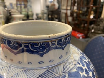 A Chinese gilt-heightened blue and white vase and cover, Kangxi/Yongzheng